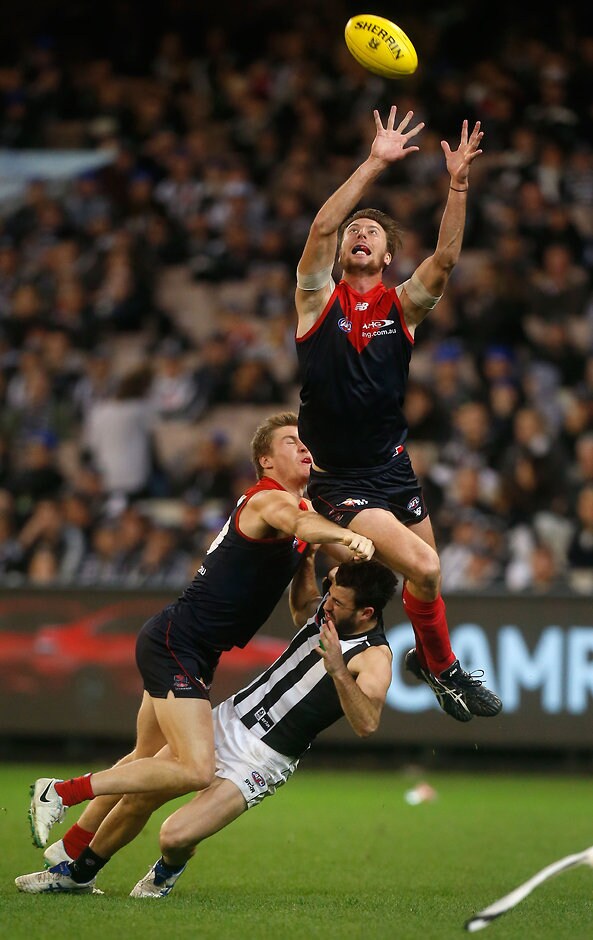 AFL 2015 Rd 10 - Melbourne v Collingwood MELBOURNE, AUSTRALIA - JUNE 08: Jack Fitzpatrick of the Demons in action with Tom McDonald of the Demons and Alex Fasolo of the Magpies during the 2015 AFL round ten match between the Melbourne Demons and the Collingwood Magpies at the Melbourne Cricket Ground Melbourne on June 8, 2015. (Photo by Adam Trafford/AFL Media)